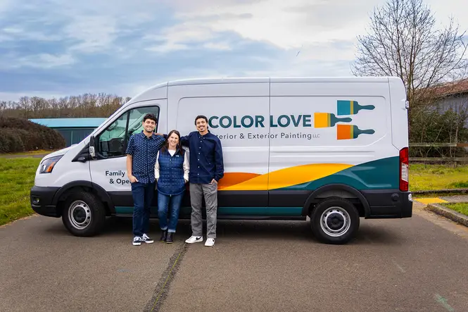 The Color Love Painting family team standing in front of their branded van