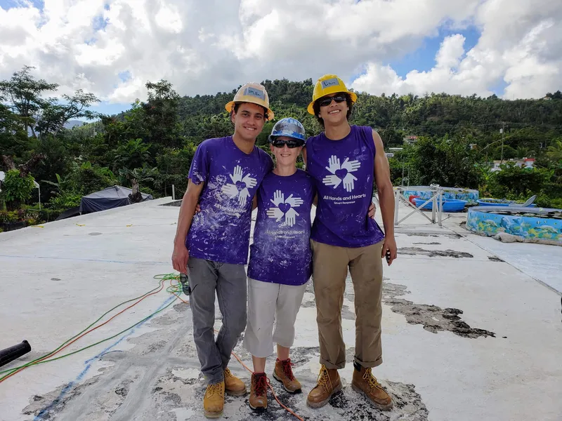 Color Love Painting team volunteering and painting roofs in Puerto Rico after hurricanes